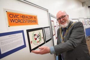 16082502 August 25th 2016 Worcester Heraldry Exhibition, Universtiry of Worcester, Worcester Mayor Paul Denham with the Worcester City coats of arms