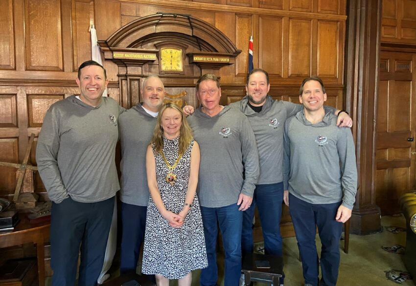 Five men stood with Mel Allcott