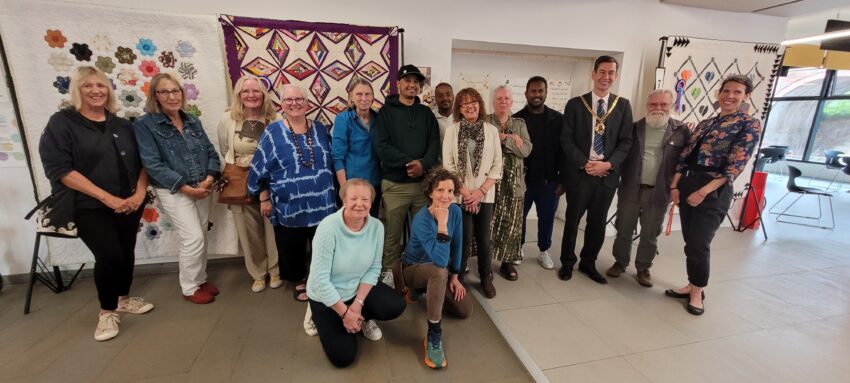 Cllr Matt Lamb with volunteers at the Refugee Week Quilts and Textiles exhibition