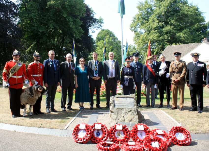 The Mayor standing with military veterans at the memorial stone in Worcester's Gheluvelt Park