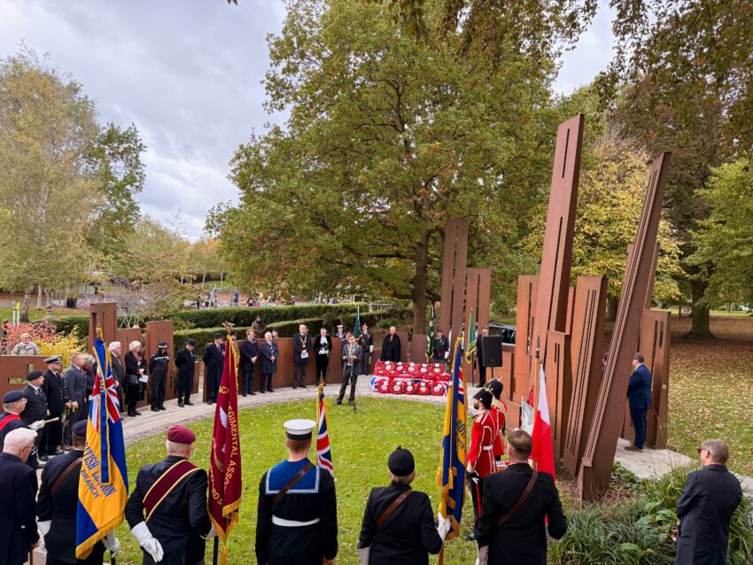 The Mayor speaking at the Battle of Gheluvelt memorial in Gheluvelt Park, Worcester. Members of the military and veterans are present.
