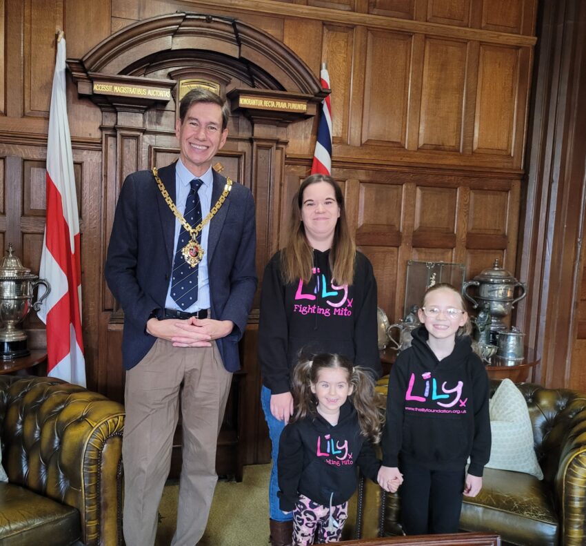 The Mayor in the Guildhall Parlour with a woman and two children