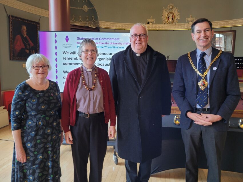 The Mayor and three other people standing in Worcester Guildhall