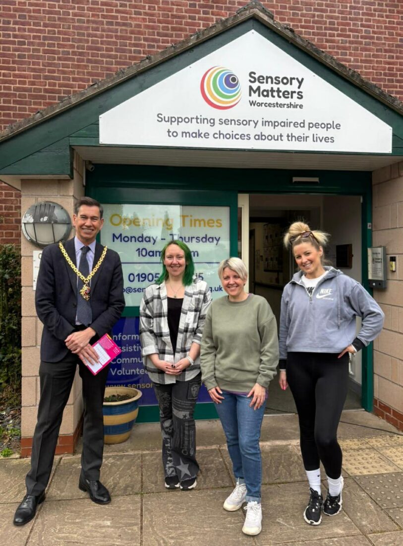 The Mayor and three women standing at the entrance to the Sensory Matters office