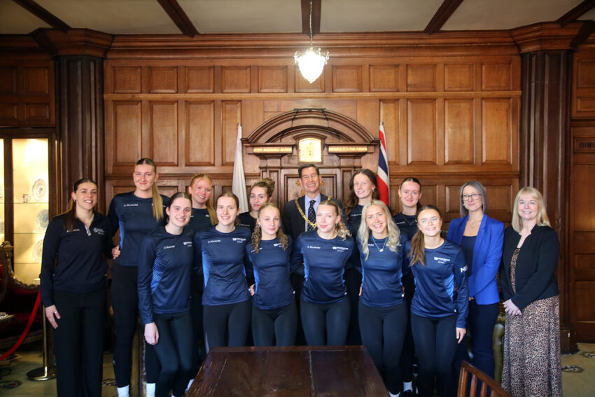 The Mayor standing with a group of women, all of whom are in University of Worcester-branded sportswear